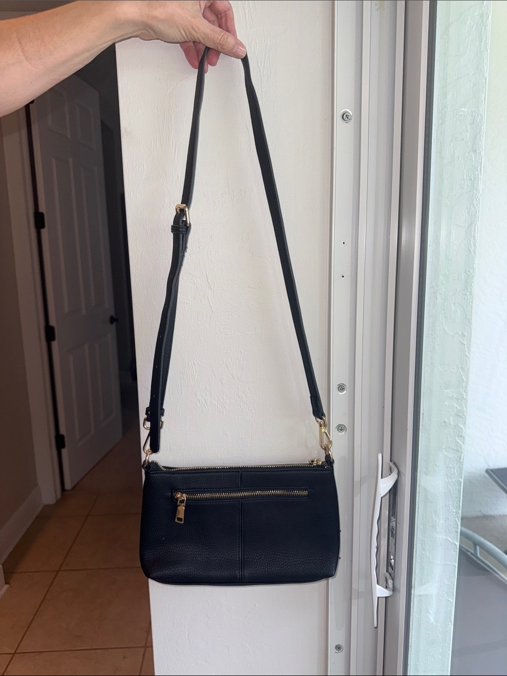 Elegant Black Pebble Leather Crossbody Bag with Gold Hardware